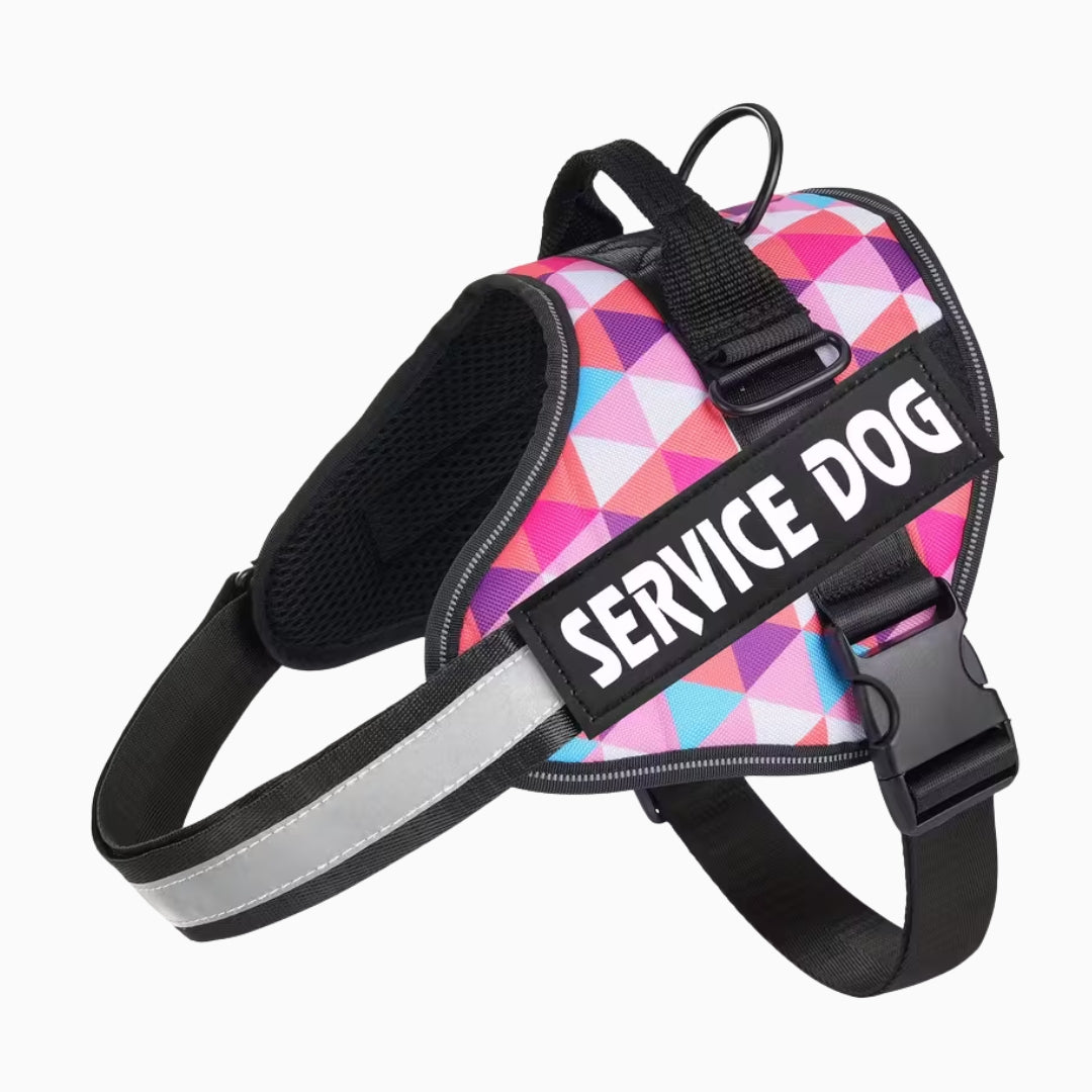 Colorful geometric patterned service dog harness with 'SERVICE DOG' text on a white background