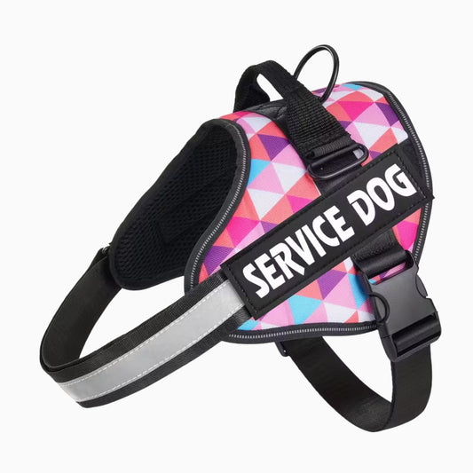 Colorful geometric patterned service dog harness with 'SERVICE DOG' text on a white background